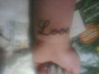 left wrist tattoo