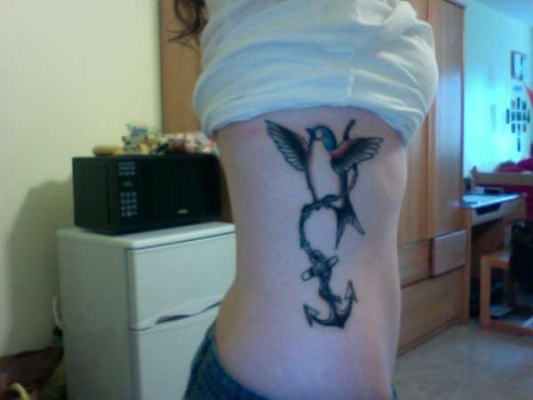 rib piece tattoo
