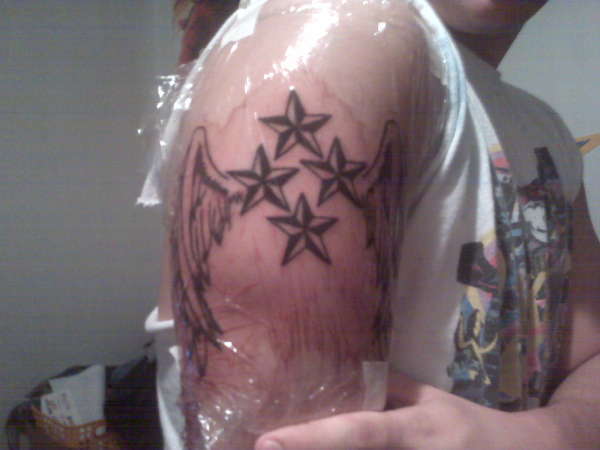 winged stars tattoo