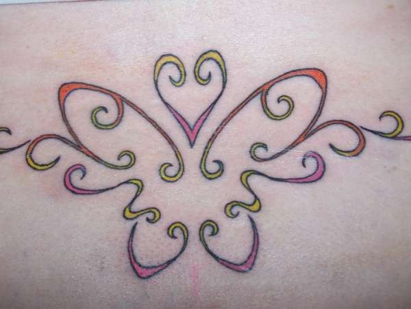 Butterfly on lower back tattoo