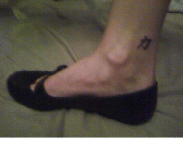 Kanji strength symbol tattoo