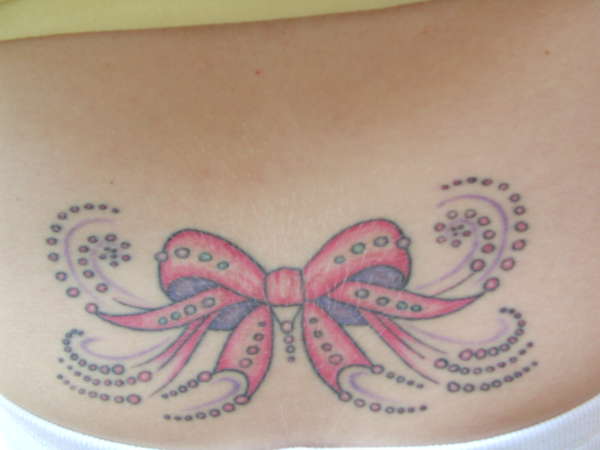 Lower Back Bow tattoo