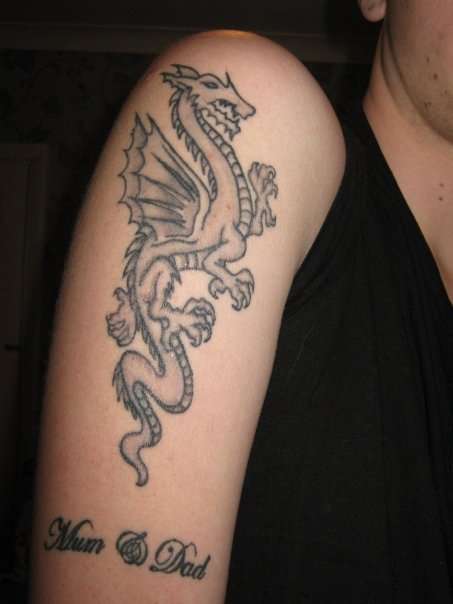 dragon with mum and dad lettering tattoo