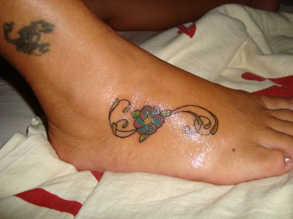 flower in the feet tattoo