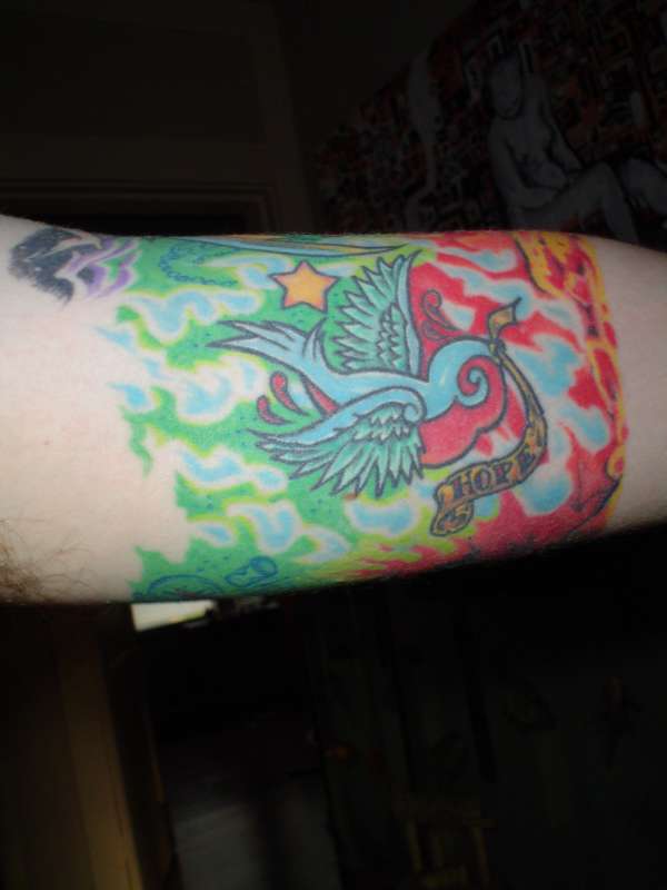 bird inside arm tattoo