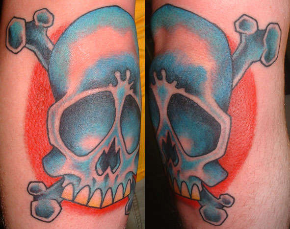 skull and cross bones on elbow tattoo