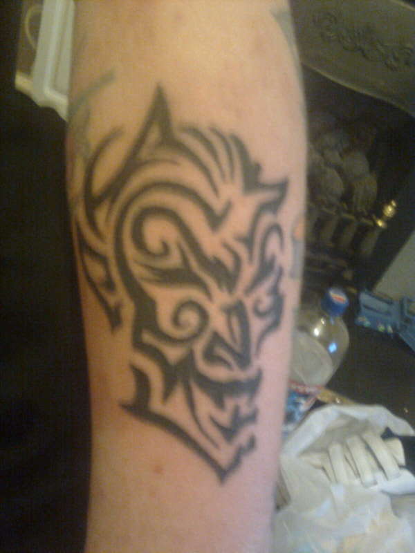 tribal devil tattoo