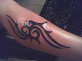 tribal leg tattoo