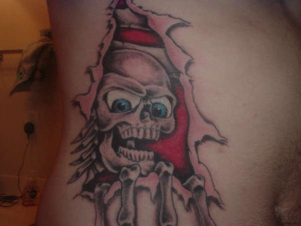 Skull Skin Rip tattoo