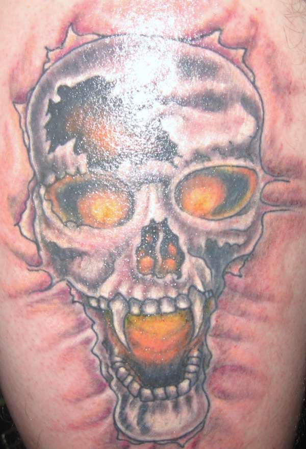 Skull on thigh tattoo