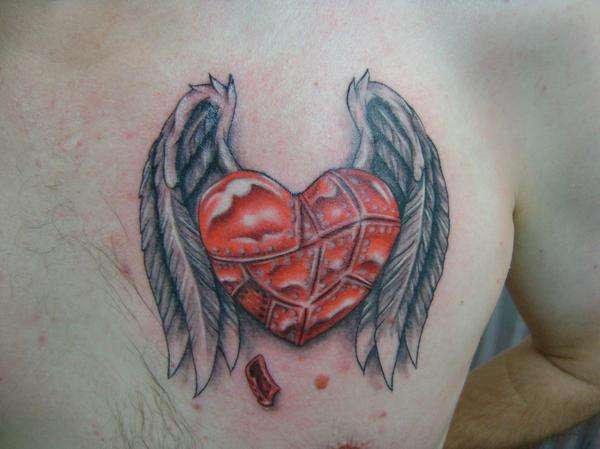 armored heart with wings tattoo