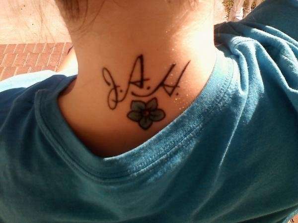 initials & forget-me-not flower tattoo