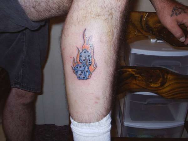 Flaming dice tattoo