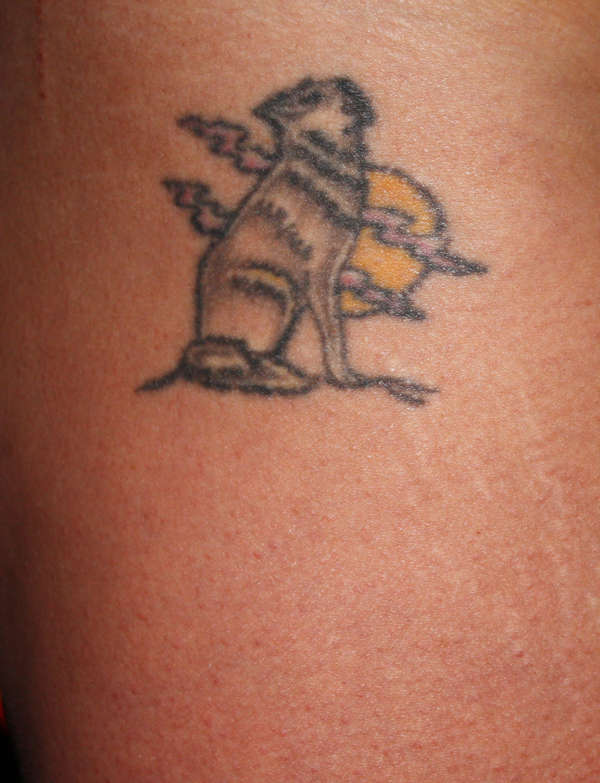 wolf to iguana tattoo