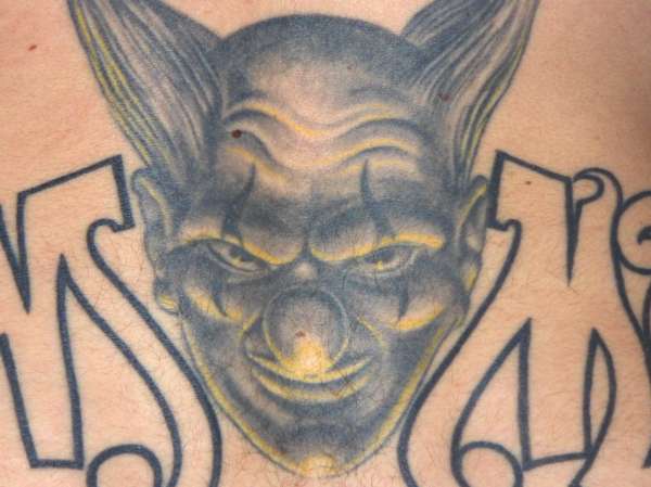 Close-up Clown - lower back tattoo