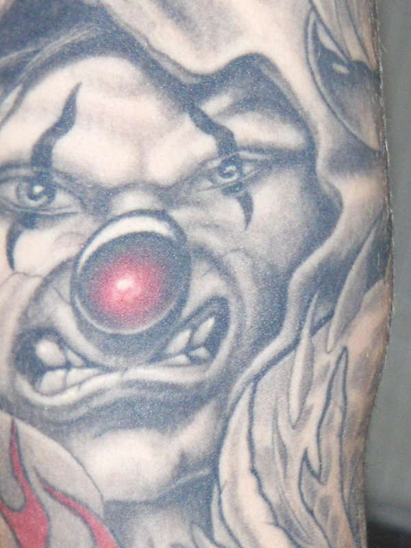 Close-up - clown left arm tattoo
