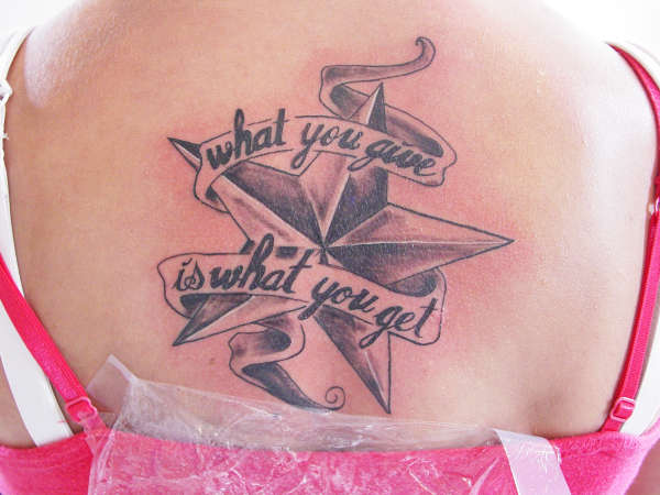 Star on back tattoo