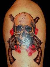 skull and guns tattoo