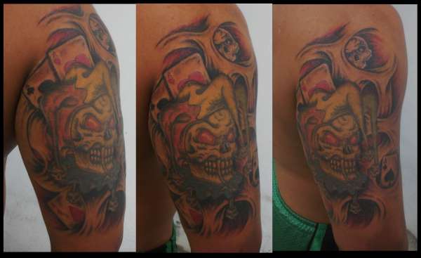 joker in biomechanic background tattoo