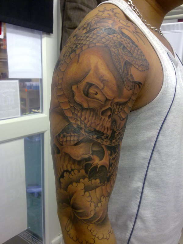 snake and sculls tattoo