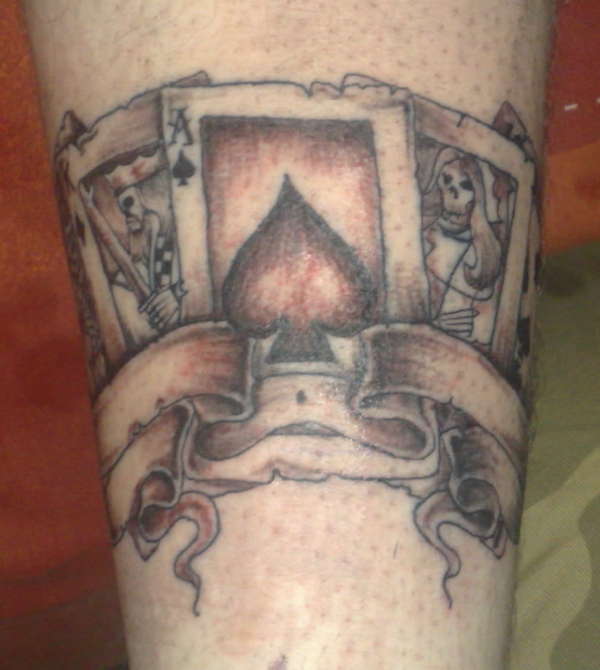 Cards- bottom of leg tattoo