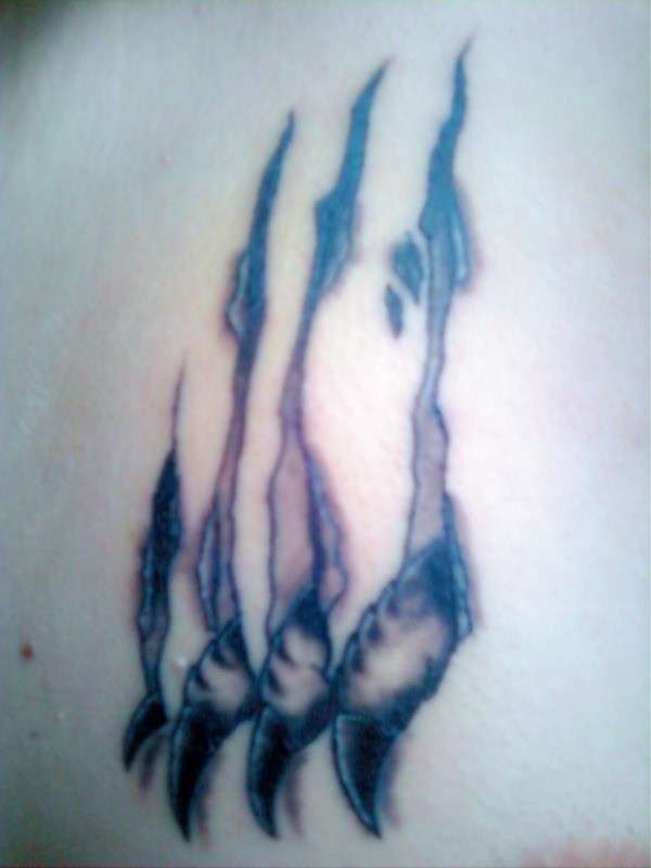 Claws Ripping Through Chest tattoo
