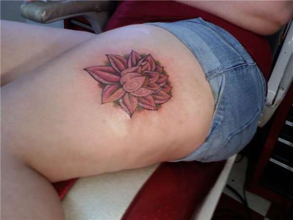 Lotus flower on left thigh tattoo