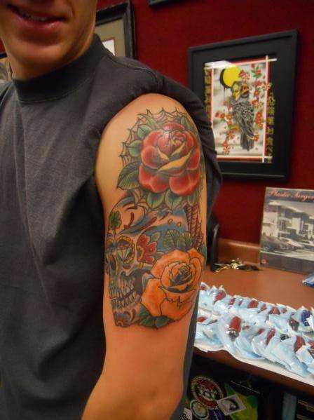 Sugar skull roses and web tattoo