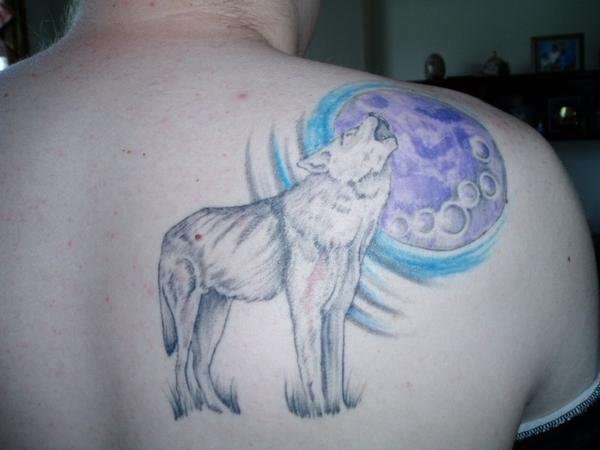 Wolf Howling At The Moon tattoo