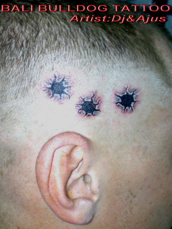 holes on head tattoo