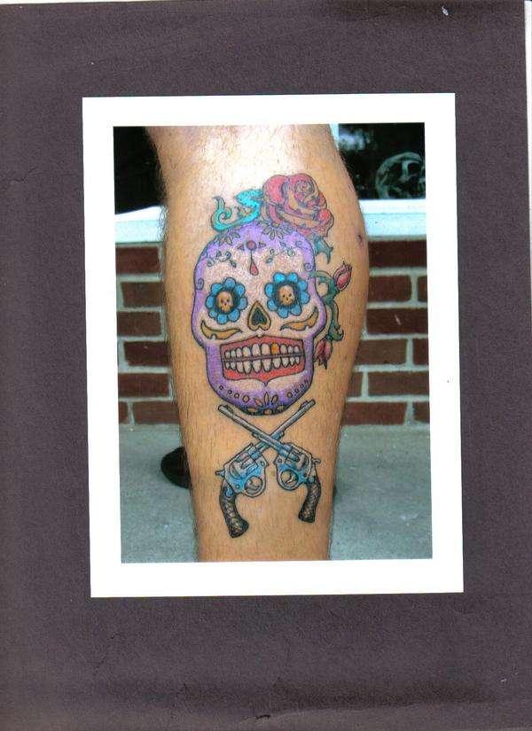 sugar skull with guns tattoo