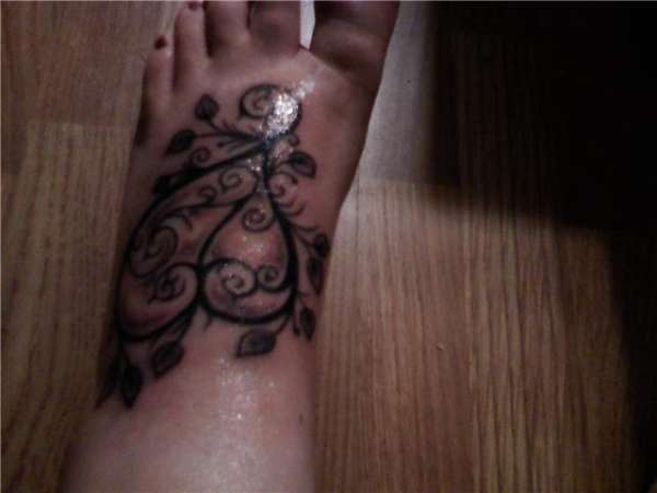 Heart on foot tattoo