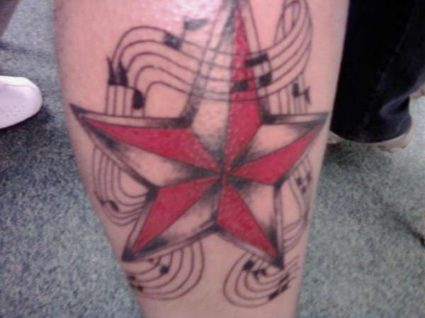 Star and notes tattoo