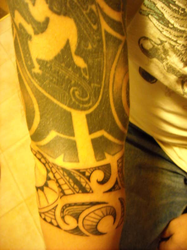 Tribal half sleeve tattoo