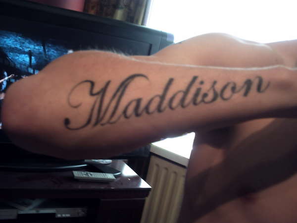 my daughters name on my arm tattoo