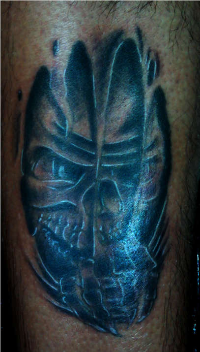 skull under flesh tattoo