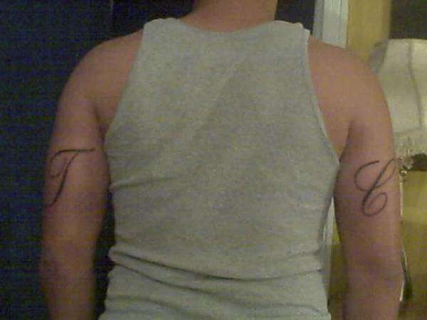 1st Tat initials tattoo