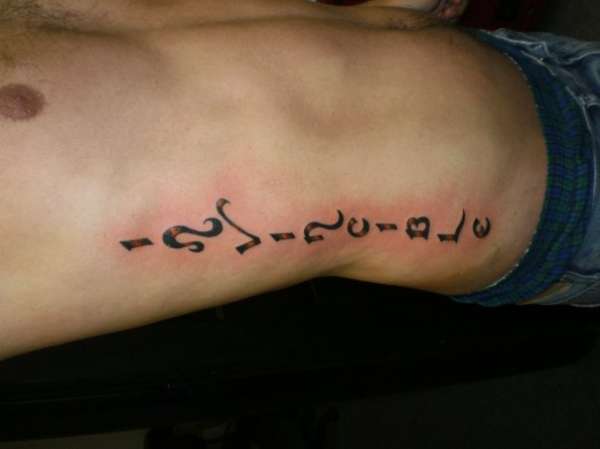 Rib Invincible Tattoo tattoo