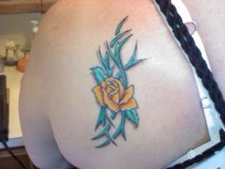 Rose amongst thorns tattoo