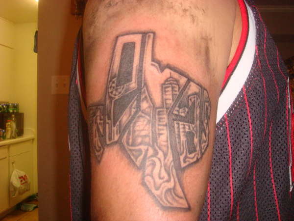 "TEXAS" with downtown Dallas skyline tattoo