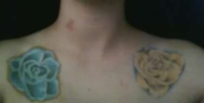 blue rose on my collar bone tattoo