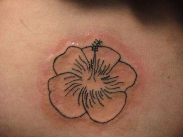 lower back flower tattoo
