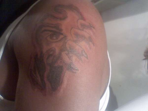 ripped demon tat tattoo