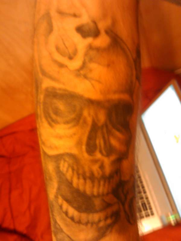 skull (bullet in head) tattoo