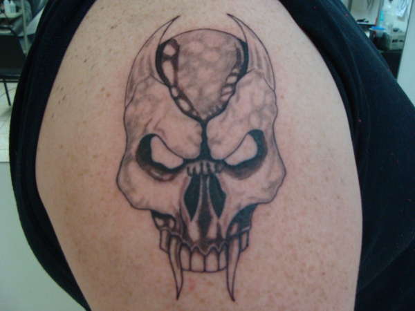 skull tattoo kuki tattoo