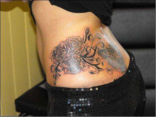 Black and grey roses on customer tattoo