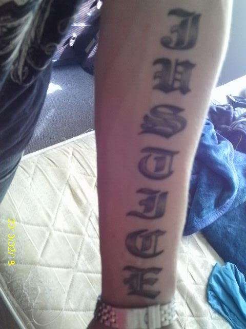 justice name tattoo