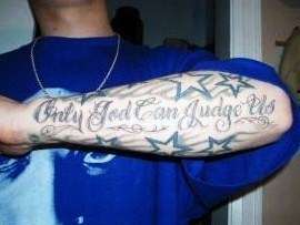 "Only God Can Judge Us" tattoo