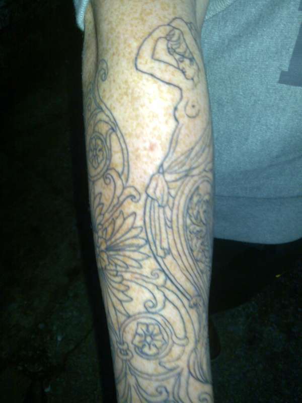 Ornamental half sleeve tattoo
