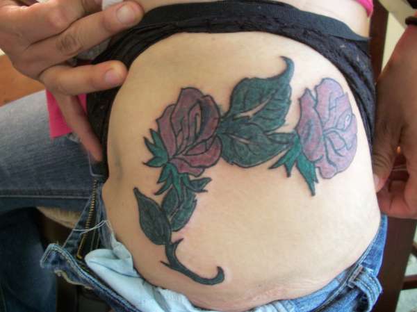 Rose. "covered a name" tattoo